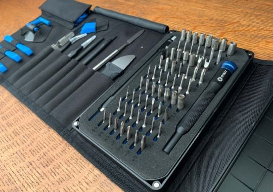 The iFixit screwdriver set left open on the table.